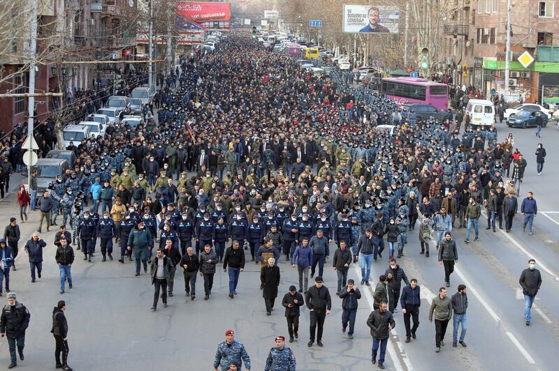 Armenian Prime Minister Nikol Pashinyan and his supporters escorted by law enforcement officers march during a rally in Yerevan, Armenia. Reuters