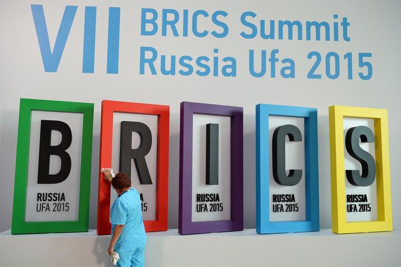 A staff cleans the logo of the BRICS summit at a hall in Ufa. Ria Novosti / AFP