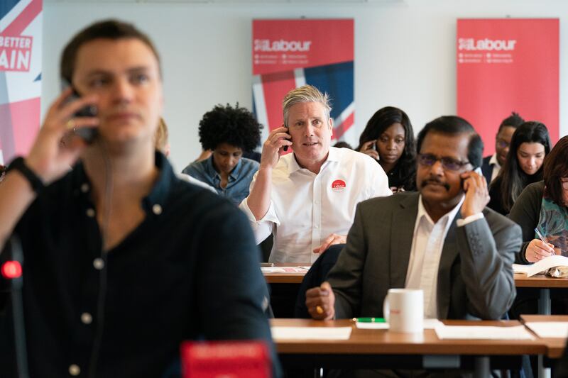Labour leader Keir Starmer joins Labour Party members in London as they speak by telephone to voters across England as part of the campaign. PA