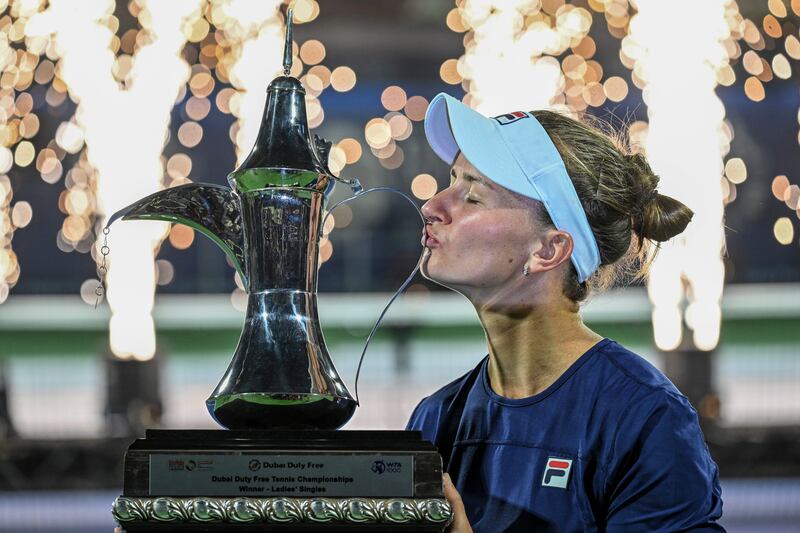 Barbora Krejcikova of Czech Republic lifts the Dubai Duty Free Tennis Championships trophy after beating Iga Swiatek of Poland in the final on Saturday, February 25, 2023. EPA