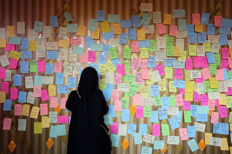 Visitors were on Monday posting messages in support of Ukraine at the country's pavilion at Expo 2020 Dubai. Pawan Singh / The National