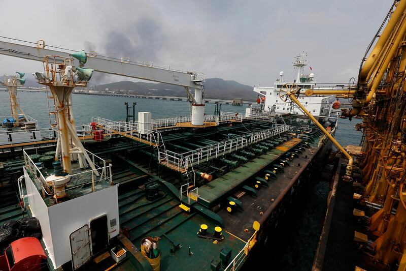 FILE - In this May 25, 2020 file photo, the Iranian oil tanker Fortune is anchored at the dock of the El Palito refinery near Puerto Cabello, Venezuela.  U.S. officials said Thursday, Aug. 13, 2020, that the Trump administration has seized the cargo of four tankers it was targeting for transporting Iranian fuel to Venezuela as it steps up its campaign of maximum pressure against the two heavily sanctioned. (AP Photo/Ernesto Vargas, File)