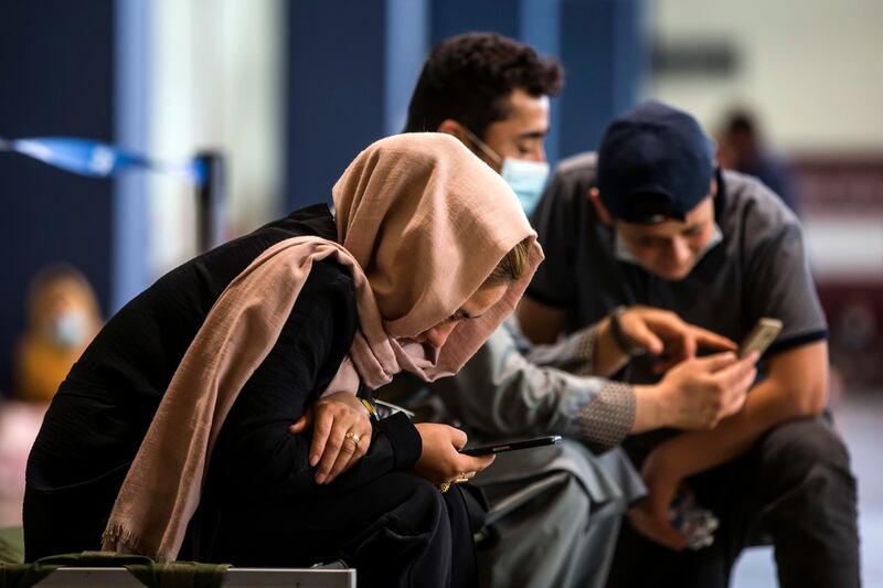 Afghan refugees after being evacuated from Afghanistan after the Taliban takeover. EPA