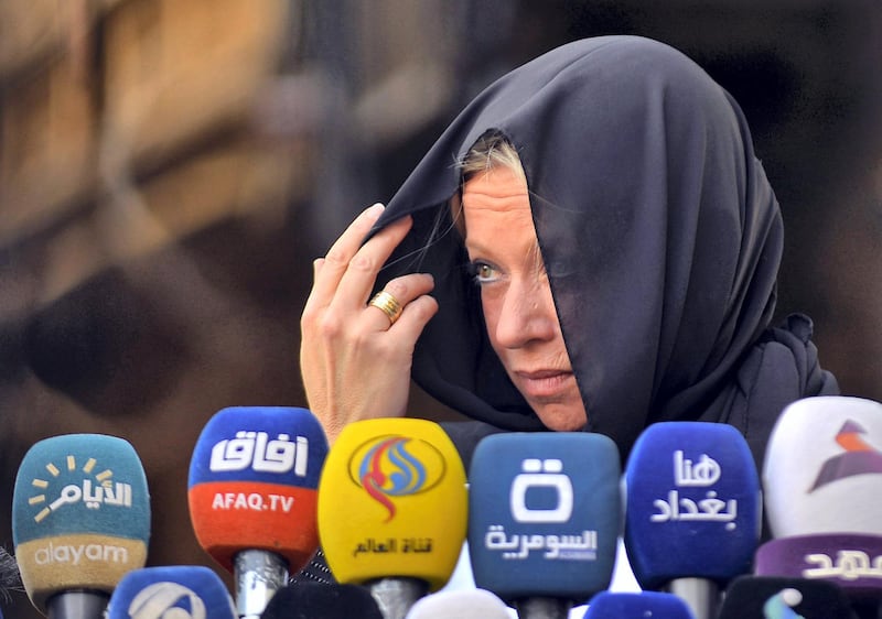 Jeanine Hennis-Plasschaert, UN Special Representative for Iraq and Head of the United Nations Assistance Mission for Iraq (UNAMI), adjusts her headscarf during a press conference following a meeting with Iraqi Shiite cleric Grand Ayatollah Ali al-Sistani in Iraq's holy city of Najaf on November 11, 2019. (Photo by Haidar HAMDANI / AFP)