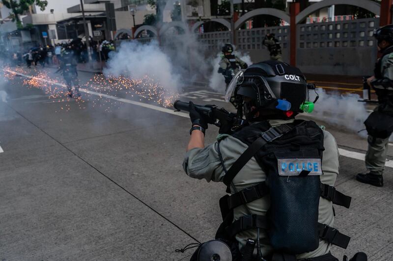 HONG KONG, CHINA - NOVEMBER 2: Riot police fire teargas during a demonstration in Wan Chai district on November 2, 2019 in Hong Kong, China. Hong Kong slipped into a technical recession on Thursday after anti-government demonstrations stretched into its fifth month while protesters continue to call for Hong Kong's Chief Executive Carrie Lam to meet their remaining demands since the controversial extradition bill was withdrawn, which includes an independent inquiry into police brutality, the retraction of the word "riot" to describe the rallies, and genuine universal suffrage.  (Photo by Anthony Kwan/Getty Images)