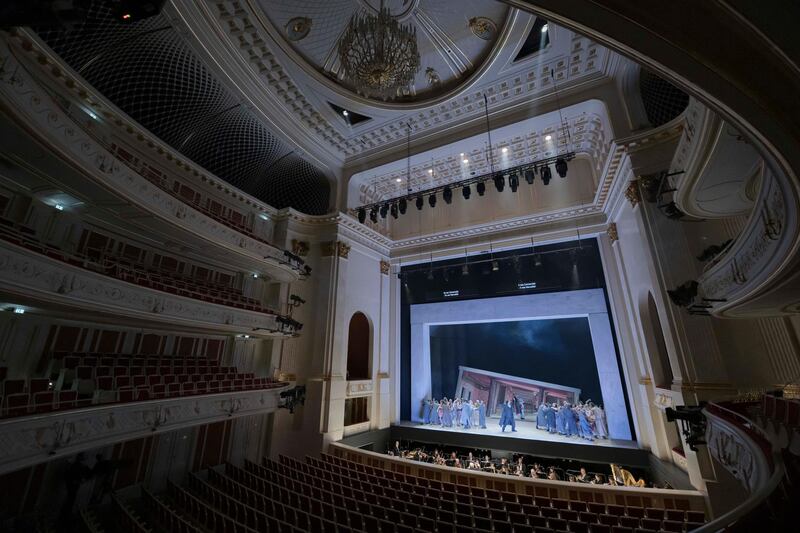 The orchestra and the ensemble of the Staatsoper perform the opera Carmen without audience in the Staatsoper Unter den Linden in Berlin, Germany, Thursday, March 12, 2020. All theatres in the German capital closed because of the coronavirus outbreak in Germany and Europe. The Staatsoper perfome without audience only for a free video stream. For most people, the new coronavirus causes only mild or moderate symptoms, such as fever and cough. For some, especially older adults and people with existing health problems, it can cause more severe illness, including pneumonia. (Staatsoper Berlin/Peter Adamik via AP)