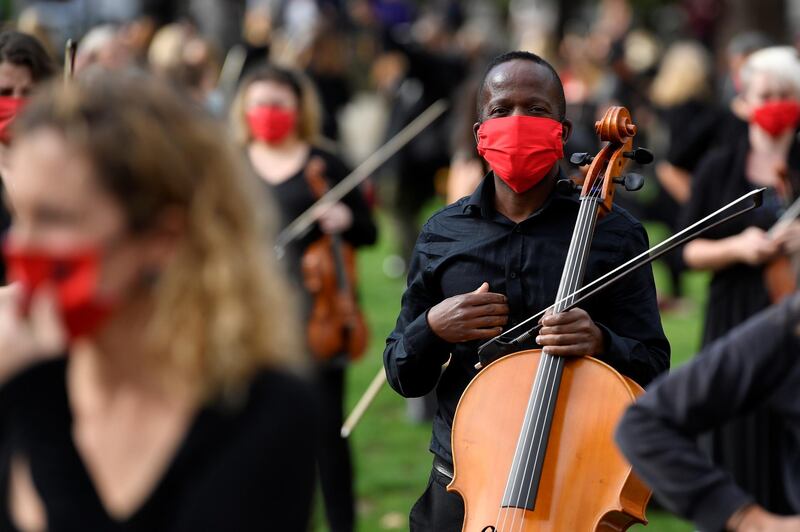 Musicians perform near the houses of Parliament in London during a protest highlighting their inability to perform live or work during the pandemic. Reuters
