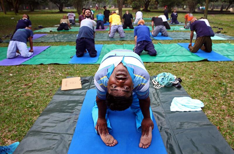 Bangladeshi men exercise in Ramna Park in Dhaka. Monirul Alam / EPA