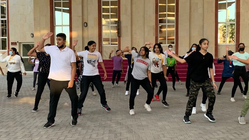 A flash mob made up of high school pupils dances at one school during a welcoming ceremony. Pawan Singh / The National