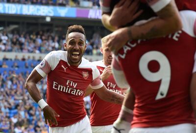 Soccer Football - Premier League - Cardiff City v Arsenal - Cardiff City Stadium, Cardiff, Britain - September 2, 2018  Arsenal's Pierre-Emerick Aubameyang celebrates scoring their second goal              REUTERS/Rebecca Naden  EDITORIAL USE ONLY. No use with unauthorized audio, video, data, fixture lists, club/league logos or "live" services. Online in-match use limited to 75 images, no video emulation. No use in betting, games or single club/league/player publications.  Please contact your account representative for further details.      TPX IMAGES OF THE DAY
