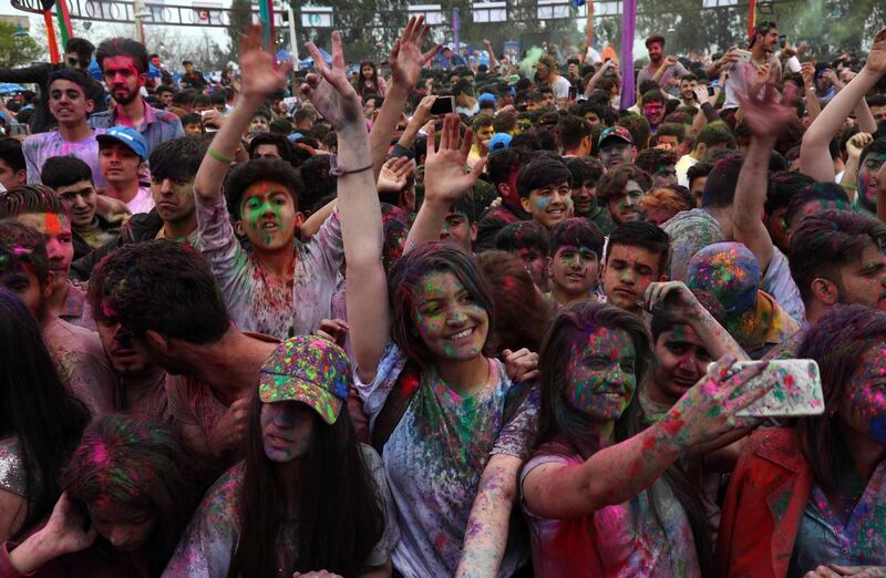 Revellers take part in a colour festival in Erbil, the capital of the autonomous Kurdish region of northern Iraq.  AFP