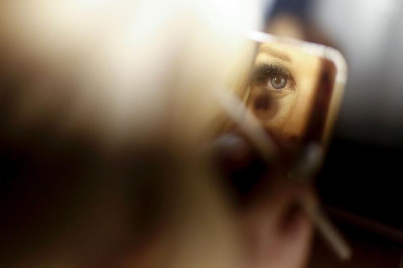 A participant gets makeup in backstage before the Miss Trans Star International in Cornella de Llobregat, Catalonia, Spain. AFP