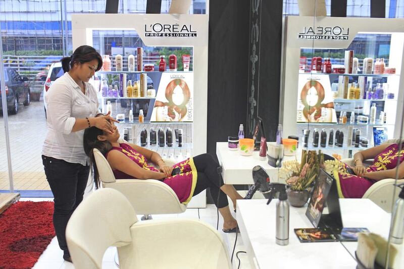 A customer gets a makeover at a L’Oreal professional spa in Mumbai. Subhash Sharma for The National