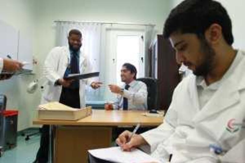 United Arab Emirates - Abu Dhabi - April 8th, 2010:  Dr Hassan Galadari, center, an emirati dermatologist, teaches a group of medical students at Tawam Hospital in Al AIn .  (Galen Clarke/The National)