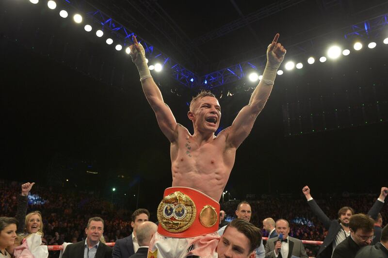 BELFAST, NORTHERN IRELAND - SEPTEMBER 6: The new IBF super-bantamweight world champion Carl Frampton of Northern Ireland celebrates after his victory over Kiko Martinez of Spain, at the purpose-built 16,000 capacity Titanic slipway outdoor arena on September 6, 2014 in Belfast, Northern Ireland. (Photo by Charles McQuillan/Getty Images).