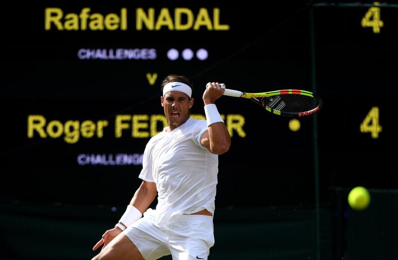LONDON, ENGLAND - JULY 12: Rafael Nadal of Spain plays a forehand in his Men's Singles semi-final match against Roger Federer of Switzerland during Day eleven of The Championships - Wimbledon 2019 at All England Lawn Tennis and Croquet Club on July 12, 2019 in London, England. (Photo by Shaun Botterill/Getty Images)