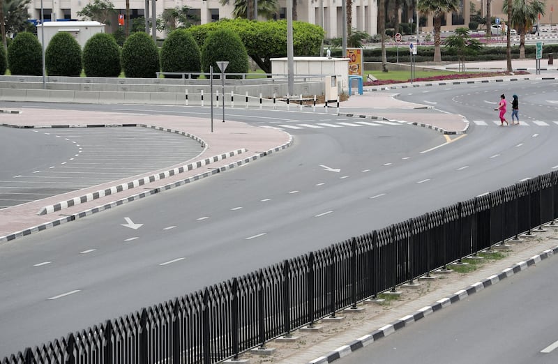 DUBAI, UNITED ARAB EMIRATES , April 11 – 2020 :-  View of the almost empty Al Maktoum road near Deira Clock tower in Deira Dubai. Dubai is conducting 24 hours sterilisation programme across all areas and communities in the Emirate and told residents to stay at home. UAE government told residents to wear face mask and gloves all the times outside the home whether they are showing symptoms of Covid-19 or not. (Pawan Singh/The National) For News/Online/Instagram/Standalone