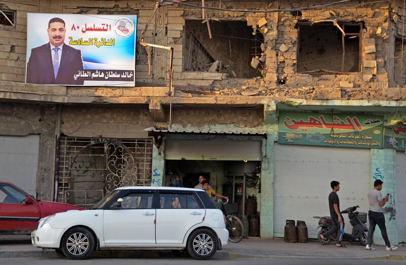 A banner for a candidate is seen in Iraq's second city of Mosul. Iraq's elections will go ahead as planned on October 10, officials say. AFP