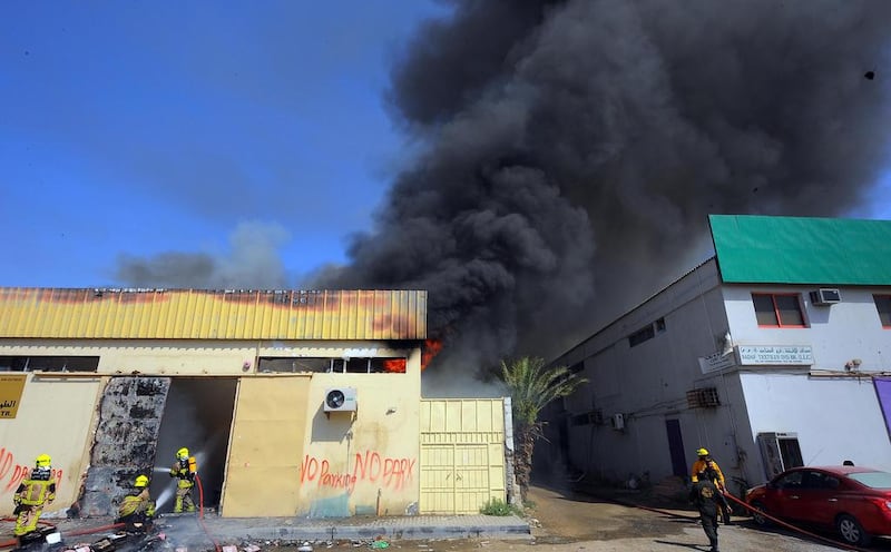 A shoe factory and a wood warehouse in Sharjah's 3rd Industrial Zone caught fire on May 7, 2014. It was the second fire in the area this week. Courtesy Al Ittihad 