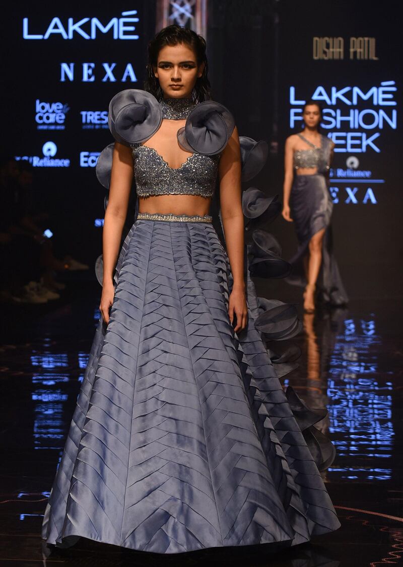 A model presents creations by designer Disha Patil at Lakme Fashion Week (LFW) Winter Festive 2019 in Mumbai on August 25, 2019.  / AFP / Sujit Jaiswal
