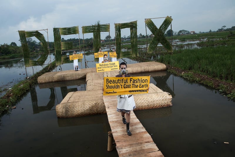 Indonesian models wear eco fashion apparels designed by Indonesian well known designers Felicia Budi, Indita Karina, Lenny Agustin during "Detox Catwalk" organised by Greenpeace in the polluted paddy field in Rancaekek, West Java province to highlight the toxic pollution brought by clothing industry as well as the idea that 'Beautiful fashion shouldn't cost the earth'.