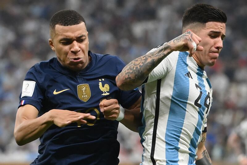 France forward Kylian Mbappe and Argentina's Enzo Fernandez fight for the ball during the World Cup final. AFP