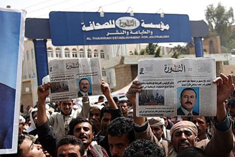 Regime supporters gathered in Sanaa on Friday to brandish copies of Al Thawra newspaper with Ali Abdullah Saleh on the cover.