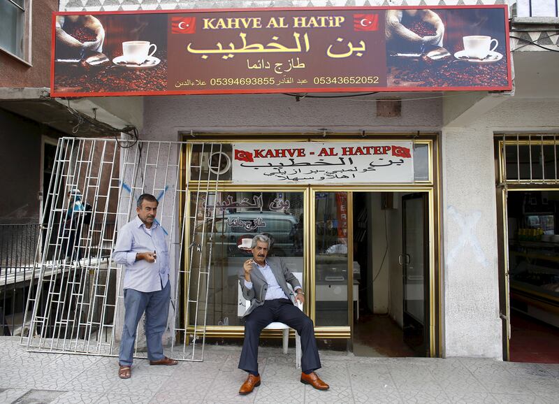 A Syrian coffee shop owner in Ankara, Turkey, sits down for a break from work. Reuters