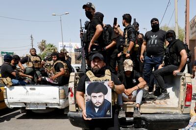 Followers of Iraqi cleric Moqtada al-Sadr withdraw from the streets after violent clashes, near the Green Zone in Baghdad, Iraq, August 30, 2022.  REUTERS / Ahmed Saad      TPX IMAGES OF THE DAY