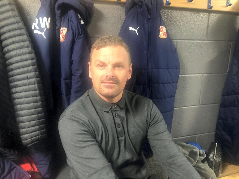Swindon manager Rich Wellens in the changing room before the game