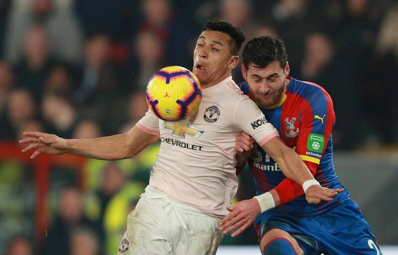 United's Alexis Sanchez in action with Palace's Joel Ward. Reuters