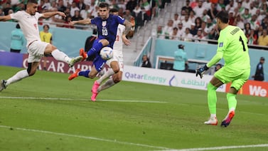 Christian Pulisic (2-L) of the US scores the 1-0 lead during the FIFA World Cup 2022 group B soccer match between Iran and the USA at Al Thumama Stadium in Doha, Qatar, 29 November 2022.   EPA / Mohamed Messara