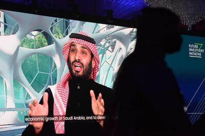 (FILES) In this file photo taken on January 28, 2021 Saudi Crown Prince Mohammed bin Salman speaks during the Future Investment Initiative (FII) conference in a virtual session in the capital Riyadh. Energy giant Saudi Aramco on May 4 posted a 30 percent jump in first quarter profits, in a sign of recovery from last year's oil market crash fuelled by the coronavirus pandemic. - 
 / AFP / Fayez Nureldine
