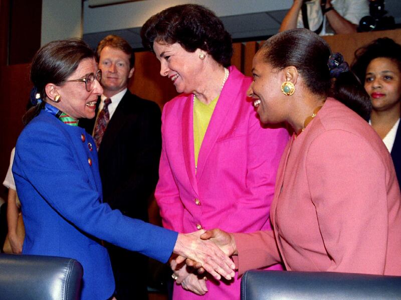 Ruth Bader Ginsburg, US President Bill Clinton's first Supreme Court nominee, is greeted by the first two women to serve on the Senate Judicary Committee, Dianne Feinstein and Carol Moseley-Braun, on July 20, 1993, before the opening of her confirmation hearings. Reuters