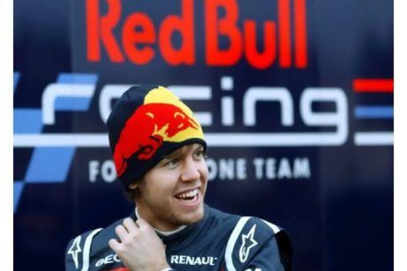 Sebastian Vettel, the world champion, has signed a new deal to stay with Red Bull until 2014. Jens Buettner / EPA