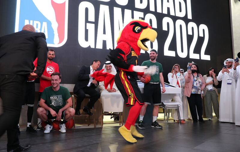 A performer dressed in the Atlanta Hawks mascot costume dances during the press conference for the NBA Abu Dhabi Games.