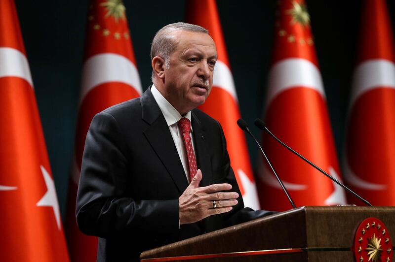 Turkish President Recep Tayyip Erdogan gestures as he delivers a speech following a cabinet meeting, in Ankara, on June 9, 2020.  / AFP / Adem ALTAN
