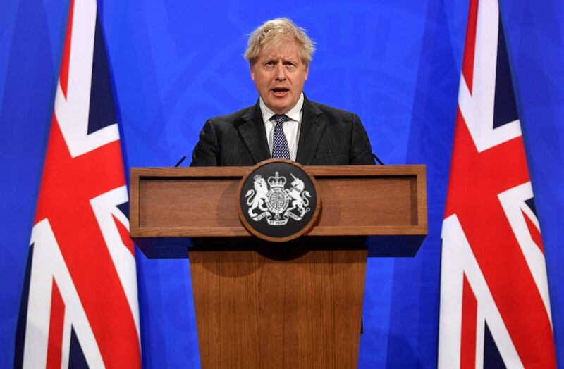 Britain's Prime Minister Boris Johnson gives an update on the coronavirus Covid-19 pandemic during a virtual press conference inside the new Downing Street Briefing Room in central London on April 20, 2021. Britain on Monday imposed its strictest travel curbs on India after an explosion of coronavirus cases there, hours after Prime Minister Boris Johnson called off a trip to New Delhi. / AFP / POOL / TOBY MELVILLE
