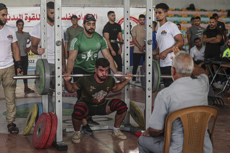 A Palestinian takes part in a weightlifting championship in the southern Gaza Strip town of Khan Yunis. 