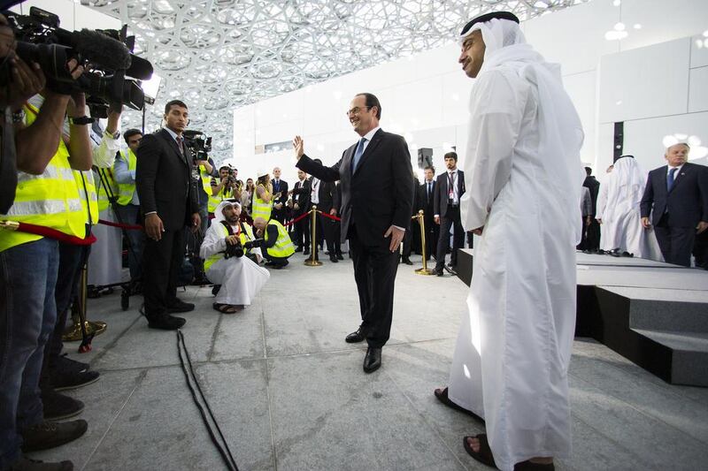 Sheikh Abdullah bin Zayed, Minister of Foreign Affairs and International Cooperation, gives French president Francois Hollande a tour of the Louvre Abu Dhabi site yesterday on Saadiyat Island. The museum is scheduled to open next year. Christopher Pike / The National