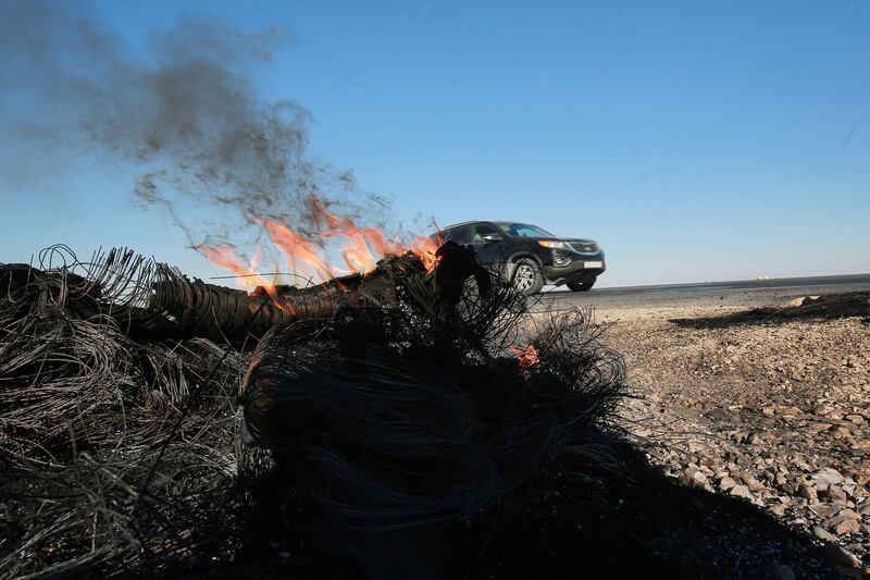 Tyres burn by the side of a road in the southern Jordanian city of Maan after violent protests over rising fuel prices. AFP