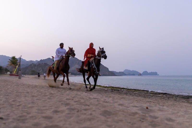 Horse riders on the beach in Oman
