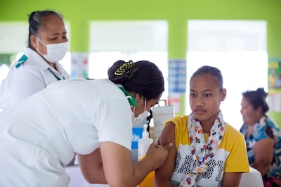 This handout picture taken on December 2, 2019 and released from UNICEF Samoa on December 4 shows a girl receiving a vaccine during a nationwide campaign against measles in the Samoan town of Le'auva'a. Authorities in Samoa asked unvaccinated families to display a red flag outside their homes on December 4 to help a mass immunisation drive aimed at halting a measles epidemic that has killed dozens of children. - ----EDITORS NOTE ----RESTRICTED TO EDITORIAL USE MANDATORY CREDIT " AFP PHOTO / ALLAN STEPHEN / UNICEF - NO MARKETING - NO ADVERTISING CAMPAIGNS - DISTRIBUTED AS A SERVICE TO CLIENTS - NO ARCHIVES
 / AFP / UNICEF / ALLAN STEPHEN / ----EDITORS NOTE ----RESTRICTED TO EDITORIAL USE MANDATORY CREDIT " AFP PHOTO / ALLAN STEPHEN / UNICEF - NO MARKETING - NO ADVERTISING CAMPAIGNS - DISTRIBUTED AS A SERVICE TO CLIENTS - NO ARCHIVES
