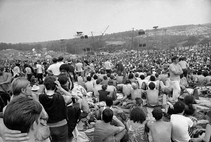FILE - This Aug. 14, 1969 file photo shows a portion of the 400,000 concert goers who attended the Woodstock Music and Arts Festival held on a 600-acre pasture near Bethel, N.Y. For the first time, an audio recording is available of nearly everything heard onstage at Woodstock 50 years ago - from transcendent music to announcements about lost people and bad acid. It's the entire Woodstock experience, minus the mud. A 38-disc package "Woodstock - Back to the Garden - The Definitive Anniversary Archive" is available now. (AP Photo/File)