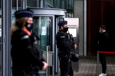 Belgian police officers stand guard at the entrance to Antwerp courthouse, on November 27, 2020, ahead of the start of the trial of four suspects including an Iranian diplomat accused of taking part in a plot to bomb an opposition rally. - In July 2018, Belgian anti-terror prosecutors announced they had foiled an attempt to bomb a June 30 meeting of the National Council of Resistance of Iran (NCRI), an exiled opposition movement, outside Paris. (Photo by Kenzo TRIBOUILLARD / AFP)