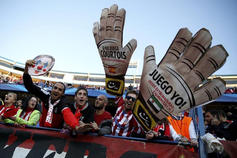 Atletico Madrid fans cheer prior to the Champions League semi-final first leg match against Chelsea on Tuesday. Paul Hanna / Reuters / April 22, 2014