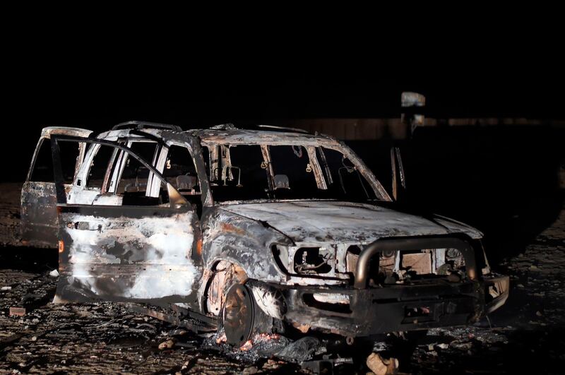 The remains of a car reportedly used by the gunmen who attacked a bus carrying Coptic Christians. AFP