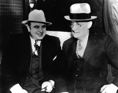 American gangster Al Capone (1899 - 1947) with US Marshall Laubenheimar.  Original Publication: People Disc - HC0216   (Photo by Keystone/Getty Images)