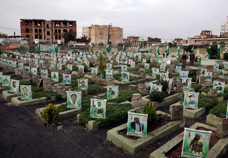 Yemenis (R) visit the grave of their relative of those who were killed in Yemenâ€™s prolonged proxy war, at a cemetery in Sana'a, Yemen, 16 March 2023.  The protracted war in Yemen is referred to as the Saudi Arabia-Iran proxy conflict as both warring parties, the Yemeni government and the Houthis, have been militarily and politically backed by Saudi Arabia and Iran respectively since 2015, claiming the lives of more than 377,000 people.   EPA / YAHYA ARHAB