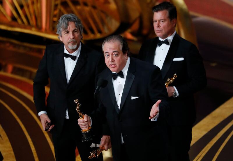 Green Book's Nick Vallelonga, Brian Currie and Peter Farrelly accept the Best Original Screenplay award. Reuters